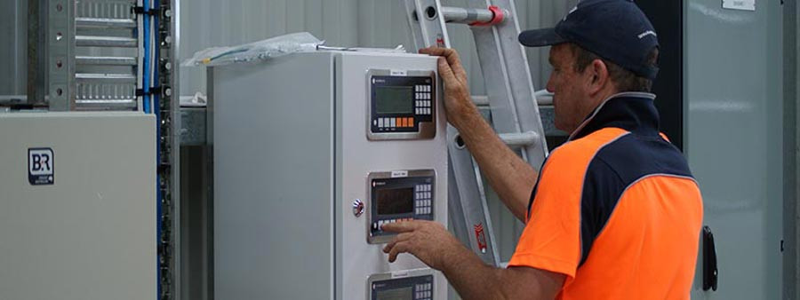 An image depicting a Gendio technician servicing a weighbridge, highlighting the importance of regular maintenance for optimal performance.